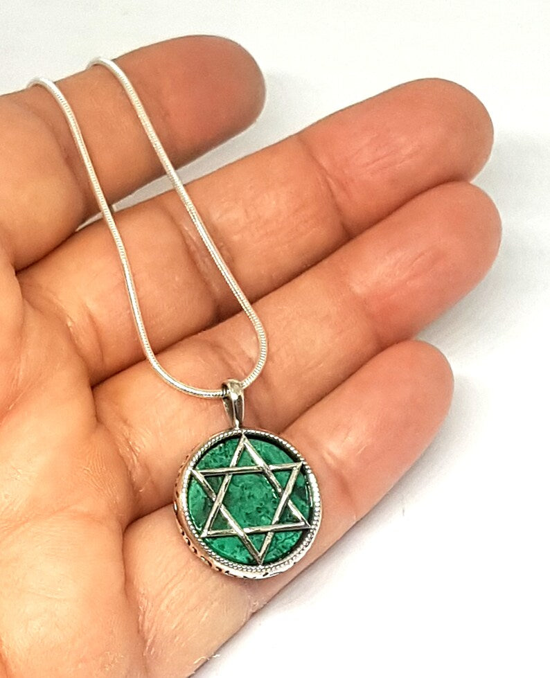 Eilat stone star of David Pendant on palm hand