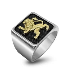 A 925 sterling silver ring with a 9k gold Lion of Judah design on top.