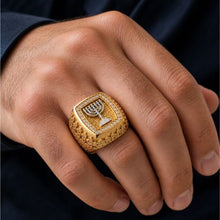 gold jerusalem ring with menorha on mens hand