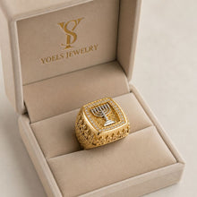 gold jerusalem ring with menorha on box
