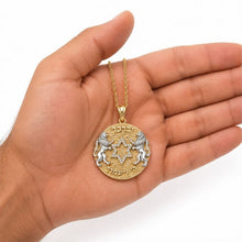 14K Gold Lion of Judah Star of David Pendant shown in hand for size reference with diamond Star of David