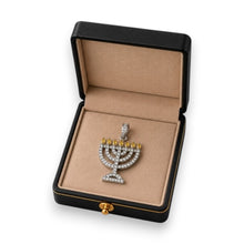Menorah pendant in a jewelry box on a white background