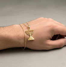 Gold menorah pendant 