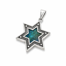 
Star of David pendant with Eilat stone center and decorative frame, sterling silver Jewish necklace symbolizing protection, identity and spiritual heritage