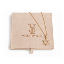 Gold necklace with star pendant on a Yoels Jewelry branded card