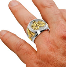 Gold and silver mens lion ring on hand 