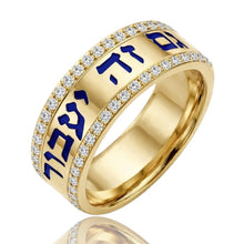 Gold ring with blue Hebrew text and diamond accents on a white background