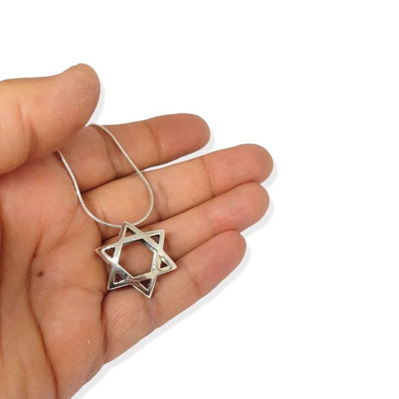 14k White Gold Double Domed Star of David Pendant on hand